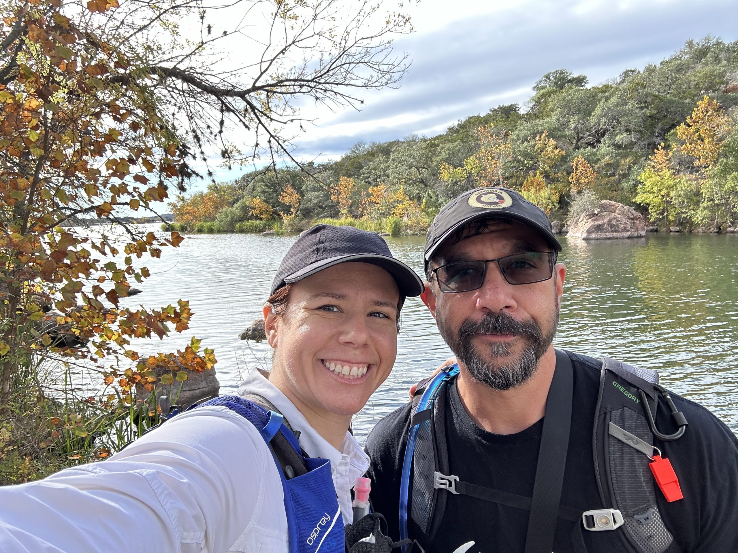 Adrienne and Aneel smiling at Inks Lake State Park.