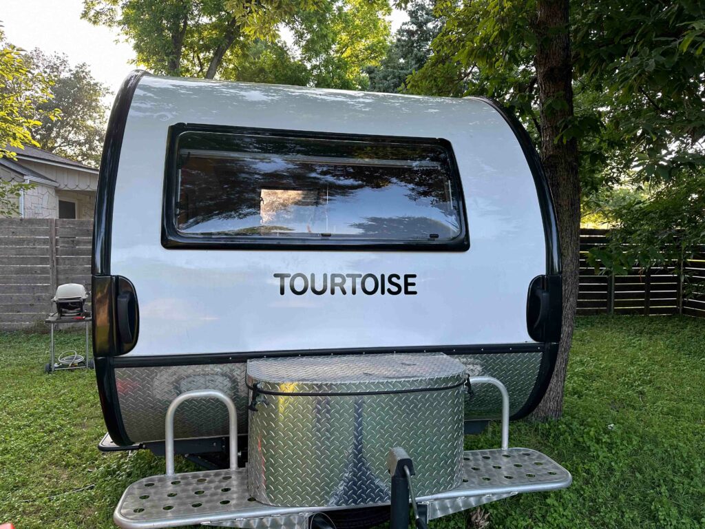 TOURTOISE is affixed to the front of the trailer