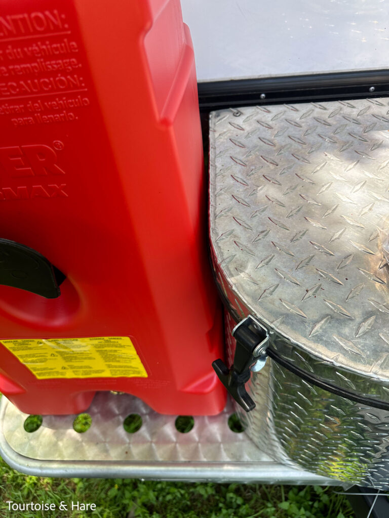 A red 14 gallon gas tank fits nicely next to the tongue box.